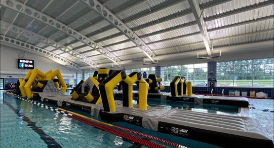 Children on an inflatable in the pool